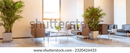 Spacious and bright hotel lobby reception area