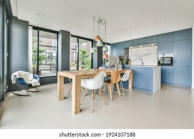 Spacious Dining Room With Wooden Table And Chairs In A Variety Of Designs