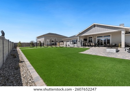 A spacious house featuring a large lawn area located right in front of it