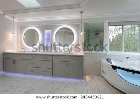Spacious modern contemporary master bathroom with remodel of vanity and wall plus shelf with lights