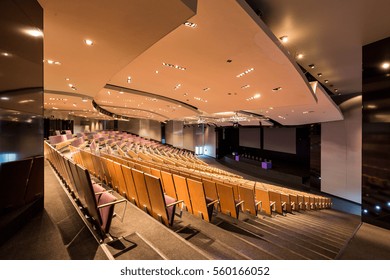 Spacious Modern Lecture Hall Theater With Lighting On Dropped Ceiling And Seats