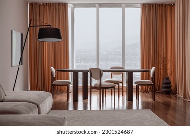 Spacious room with a designer dining table, chairs and interior decor