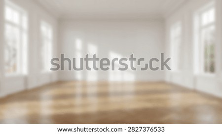A spacious, sunlit empty room with gleaming hardwood floors and large windows that create beautiful light patterns on the walls.