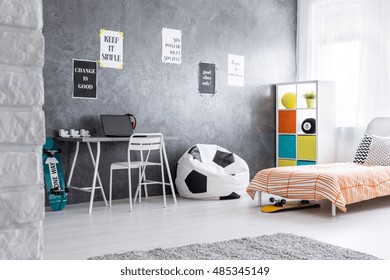 Spacious Teenager Room With Bean Bag Chair, Bed And Desk