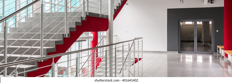 Spacious Wide Hallway With Marble Floor Of Modern New University. On The Left Wide Stairs On The First Level