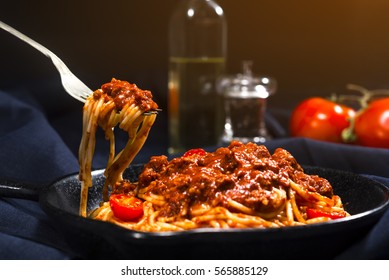 Spaghetti with bolognese on a fork.
