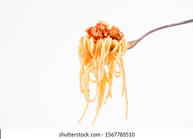 Spaghetti Bolognese On A Fork On A White Background
