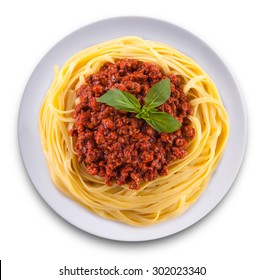Spaghetti bolognese top view on a plate. Isolated on white.