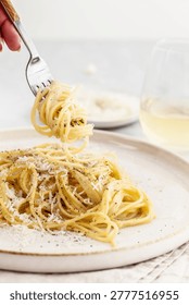 Spaghetti cacio e pepe with cheese and black pepper