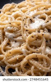 Spaghetti Cacio e Pepe, a typical recipe of pasta with cheese and black pepper, Italian Food 