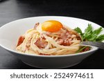 Spaghetti Carbonara with egg yolk