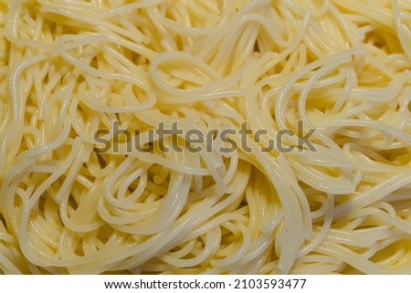 Spaghetti close up, full frame. Fresh cooked organic pasta close up, food background