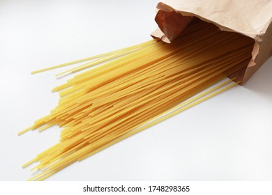 Spaghetti In A Craft Bag. Macaroni Is Scattered On The Table