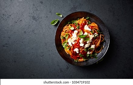 Spaghetti with Fresh Tomato Sauce, Mozzarella and Basil - Shutterstock ID 1034719102