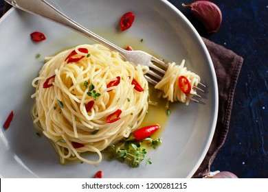 Spaghetti with garlic, olive oil and hot red  pepper top view - Shutterstock ID 1200281215