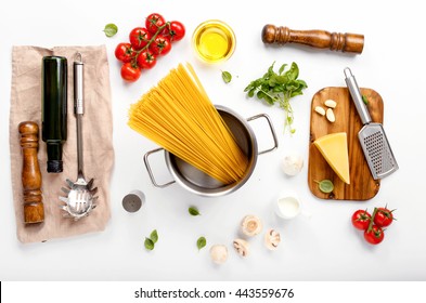 Spaghetti With Ingredients For Cooking Pasta On A White Background, Top View