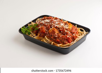 Spaghetti With Marinara And Homemade Meatballs Topped With Parmesan Cheese And Italian Parsley. Served In A To Go Container.