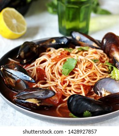 Spaghetti With Mussels, Tomato Sauce. Sea Food Meal. Mussels Marinara. Typical Dish Of Italian Pasta.