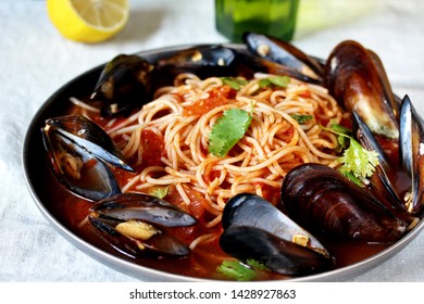 Spaghetti With Mussels, Tomato Sauce. Sea Food Meal. Mussels Marinara. Typical Dish Of Italian Pasta.