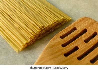 spaghetti noodles on marble table - Shutterstock ID 1885575592
