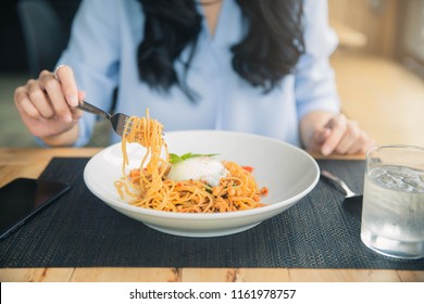 Spaghetti On A Fork. Girl Keeping Fork With Spaghetti.  Young Woman Eating Italian Pasta.