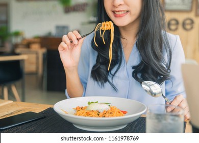 Spaghetti On A Fork. Girl Keeping Fork With Spaghetti.  Young Woman Eating Italian Pasta.