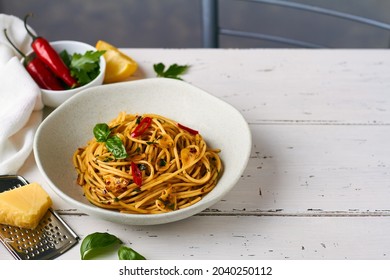 Spaghetti Pasta Aglio E Olio With Chili Flakes Parsley Garlic On White Background