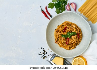 Spaghetti Pasta Aglio E Olio With Chili Flakes Parsley Garlic On White Background