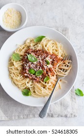 Spaghetti pasta with bolognese sauce and  parmesan cheese, top view