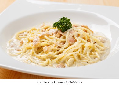 Spaghetti Pasta Carbonara Sauce With Tomato And Basil Leaf