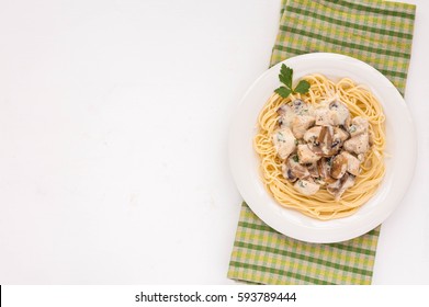 Spaghetti Pasta With Champignons, Chicken And Sauce On White Background. Flat Lay, Top View