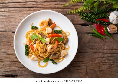 Spaghetti with Spicy Mixed Seafood and basil.Thai fusion food.Top view. - Shutterstock ID 1873637356