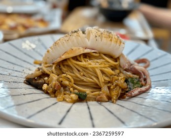 spaghetti with squid, ready to be served - Shutterstock ID 2367259597