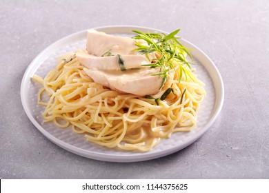 Spaghetti With Tarragon Chicken Served On Plate