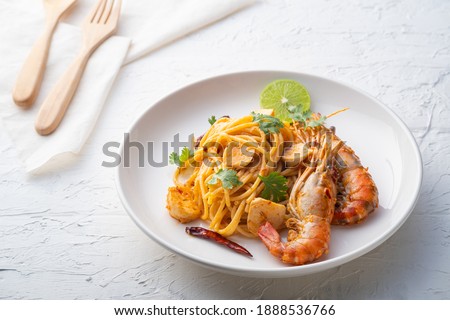 Spaghetti Tom Yum Kung,Thai style fusion food, spicy pasta with Giant freshwater prawns in tom yum sauce.