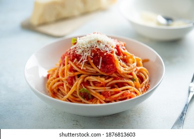 Spaghetti With Tomato Sauce And Basil On A Plate