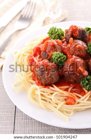 Similar – Image, Stock Photo Meatballs in tomato sauce on black tray. Above view of meat dish