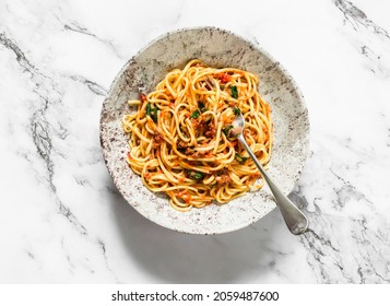 Spaghetti With Tomatoes Canned Tuna Sauce On A Light Background, Top View