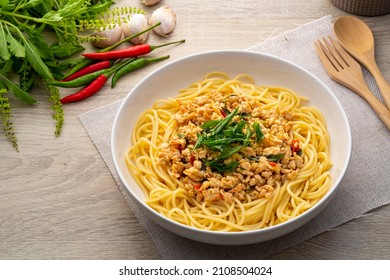 Spaghetti topped with stir fried minced chicken and basil,Spicy pasta Pad Kra Pao,Thai fusion food