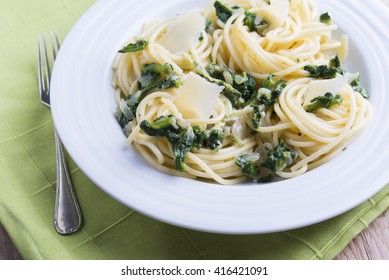 Spaghettis with spinach and Parmesan.