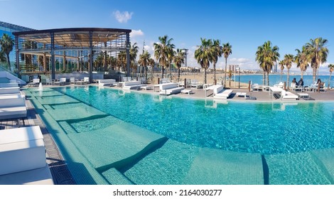 SPAIN, BARCELONA, MARCH, 2022 - Recreation area with swimming pool on the territory of the W Hotel or Hotel Vela in Barcelona, Catalonia, Spain