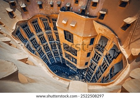 Spain, Catalonia, Barcelona famous building designed by Antonio Gaudi in Catalan Modernism style - roof, windows, organic architecture
