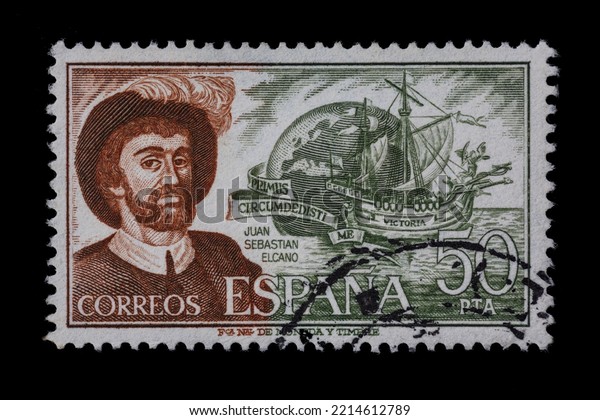SPAIN CIRCA 1976. Cancelled postage stamp\
depicting the explorer and navigator Juan Sebastian Elcano.\
Credited with first circumnavigation of the globe in his ship the\
Victoria, also pictured.