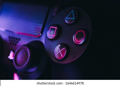 MÁLAGA -  SPAIN - FEBRUARY 16, 2020: Playstation 4 Gamepad on black background with color lights. Sony PS4 Dualshock V2. Studio Shot.