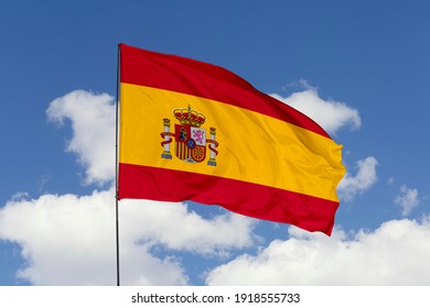 Spain flag isolated on the blue sky with clipping path. close up waving flag of Spain. flag symbols of Spain. - Shutterstock ID 1918555733