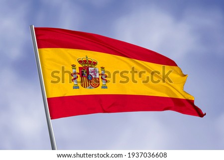 Spain flag isolated on sky background. close up waving flag of Spain. flag symbols of Spain.