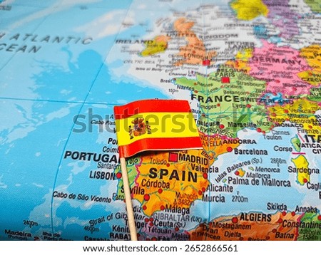 Spain Flag on Map – Close-up of Spanish National Flag Pinpointing Country Location for Geography, Travel, Politics, Education, or Western Europe Cultural Concept. 