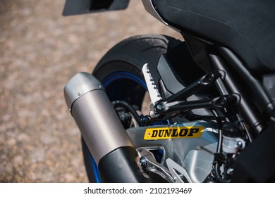 Almería, Spain - May 4th 2021: Close up view of Dunlop motorbike tyre and exhaust on Yamaha motorbike during Dunlop Xperience showroom and test in Almería, Spain.