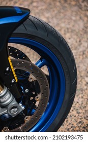Almería, Spain - May 4th 2021: Close up view of Dunlop motorbike tyre and brake disc on Yamaha motorbike during Dunlop Xperience showroom and test in Almería, Spain.