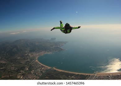 Spain. Skydiving Man In Empuriabrava. Men Fly Above The City. 